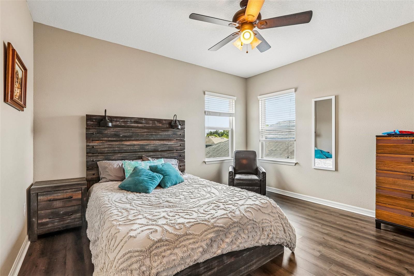 Bedroom 4 with new laminate flooring, walk in closet and ensuite bathroom
