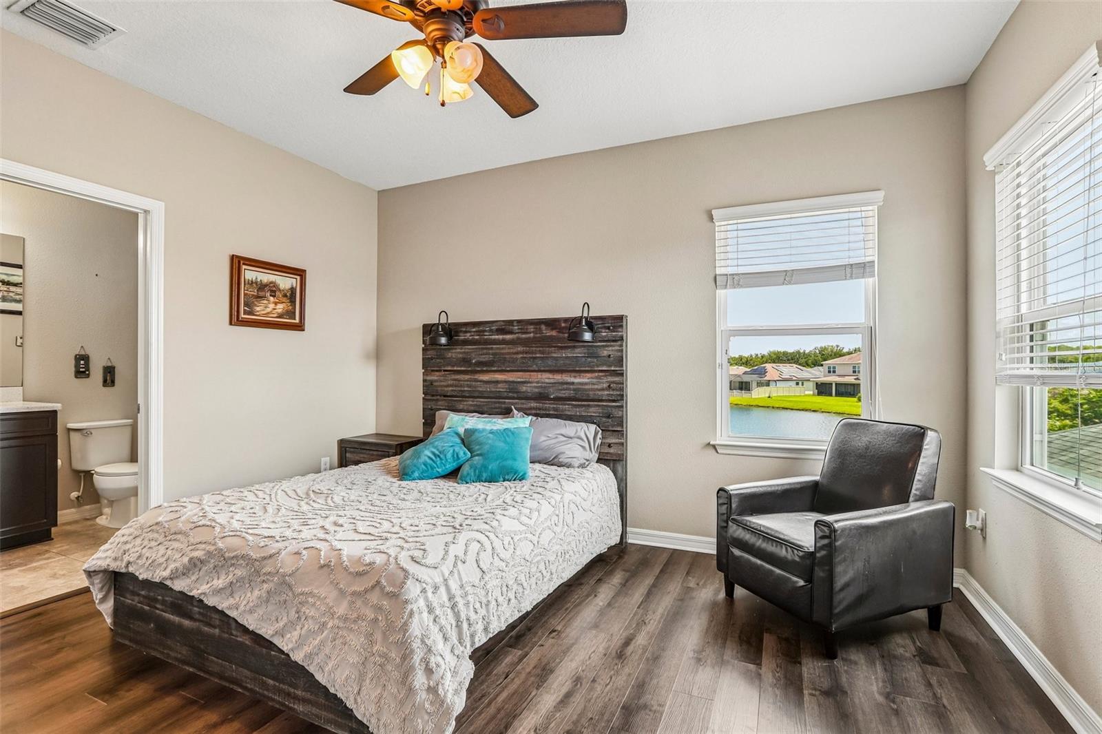 Bedroom 4 with new laminate flooring, walk in closet and ensuite bathroom