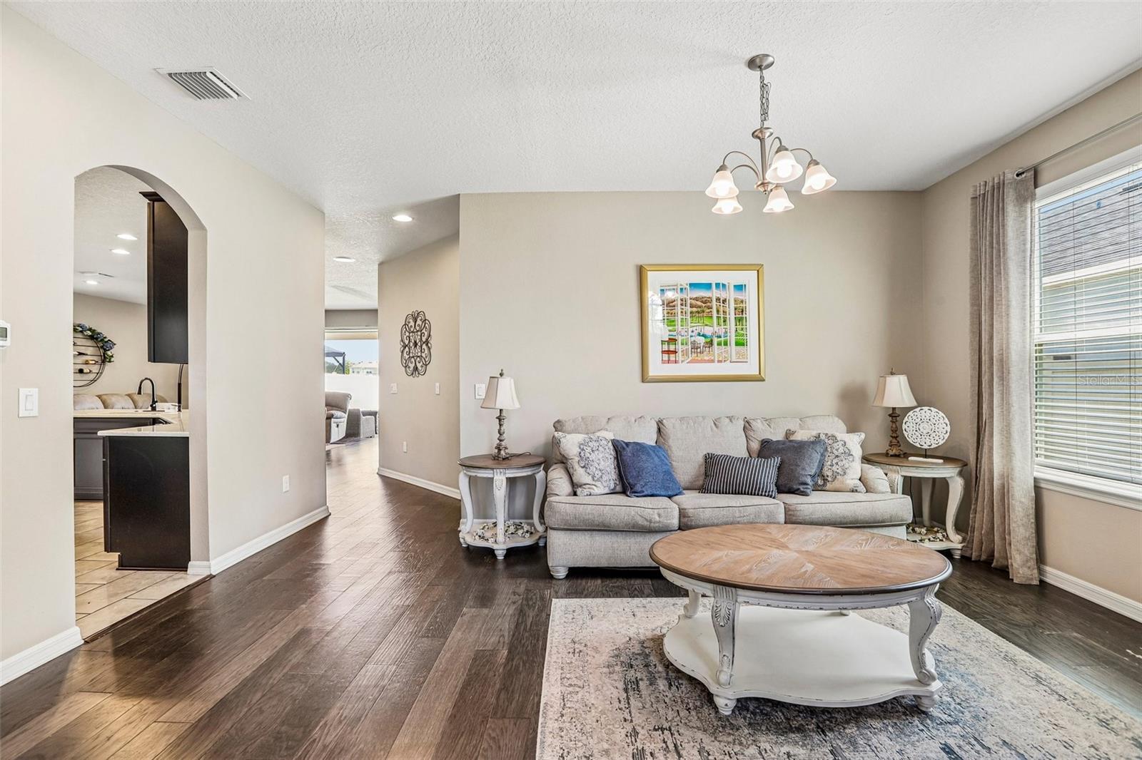 Inviting Living Room with hard wood floors and neutral colors