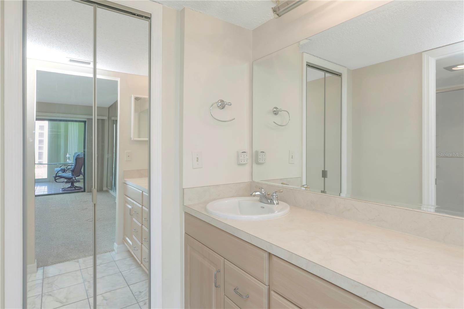 Primary ensuite full bathroom with walk-in closet