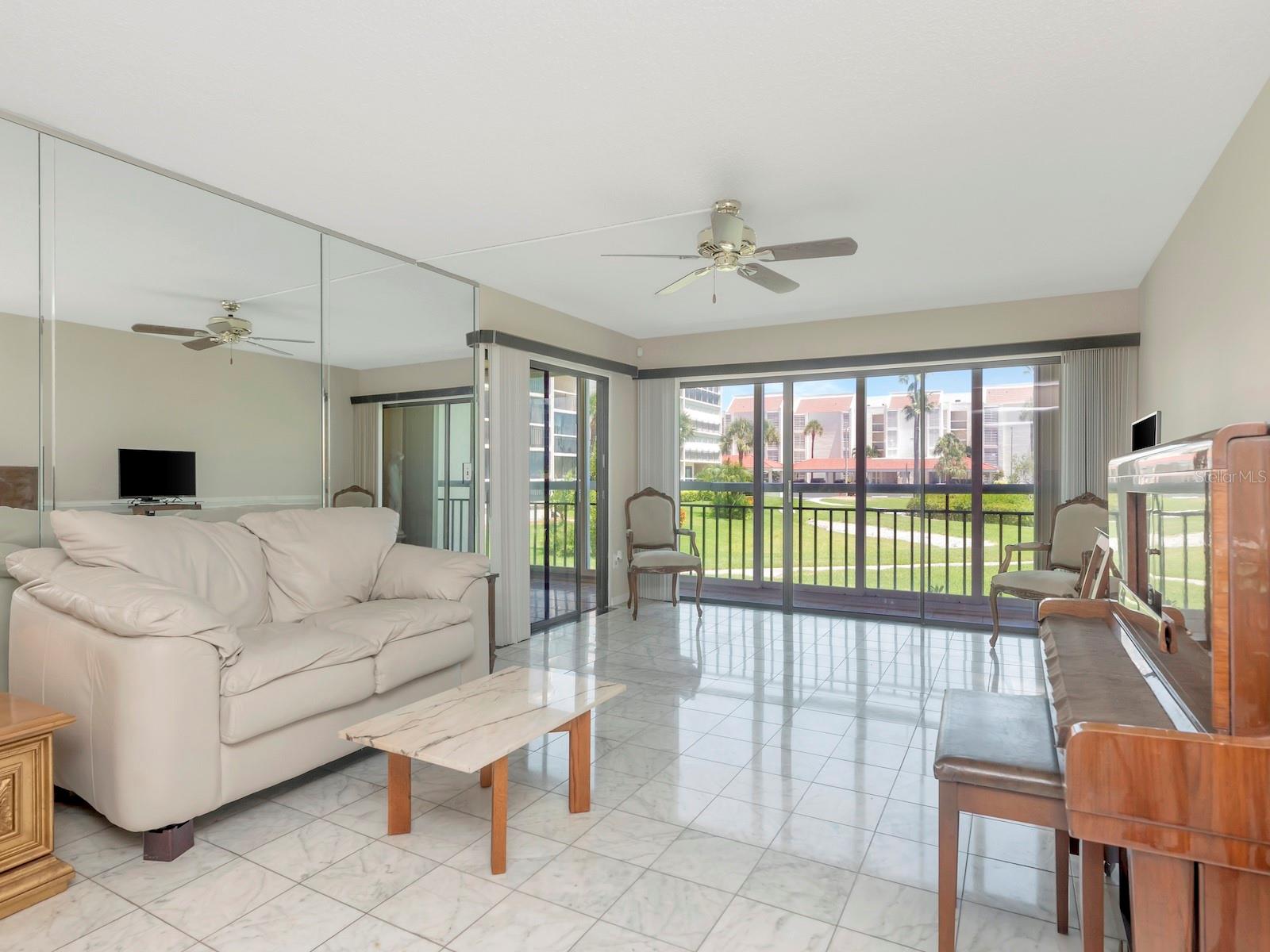 Living room with direct access to Florida room - Hurricane impact patio doors