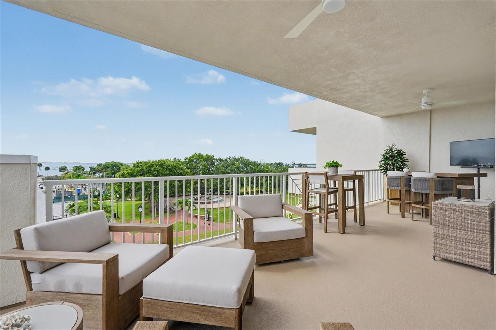 Large balcony with beautiful views of the Downtown, the park and Tampa Bay.