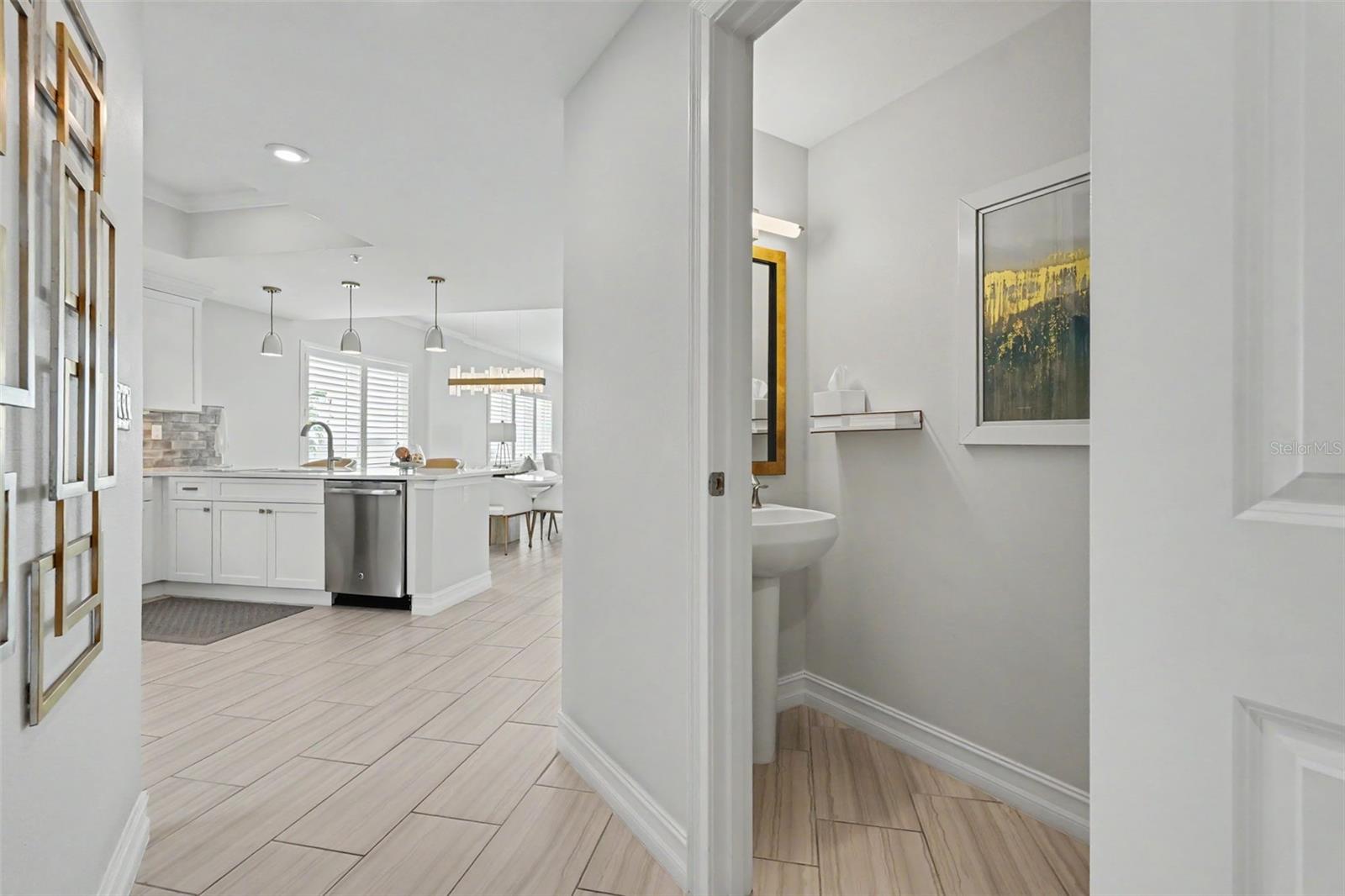 Hallway leading into the living area, kitchen and balcony.