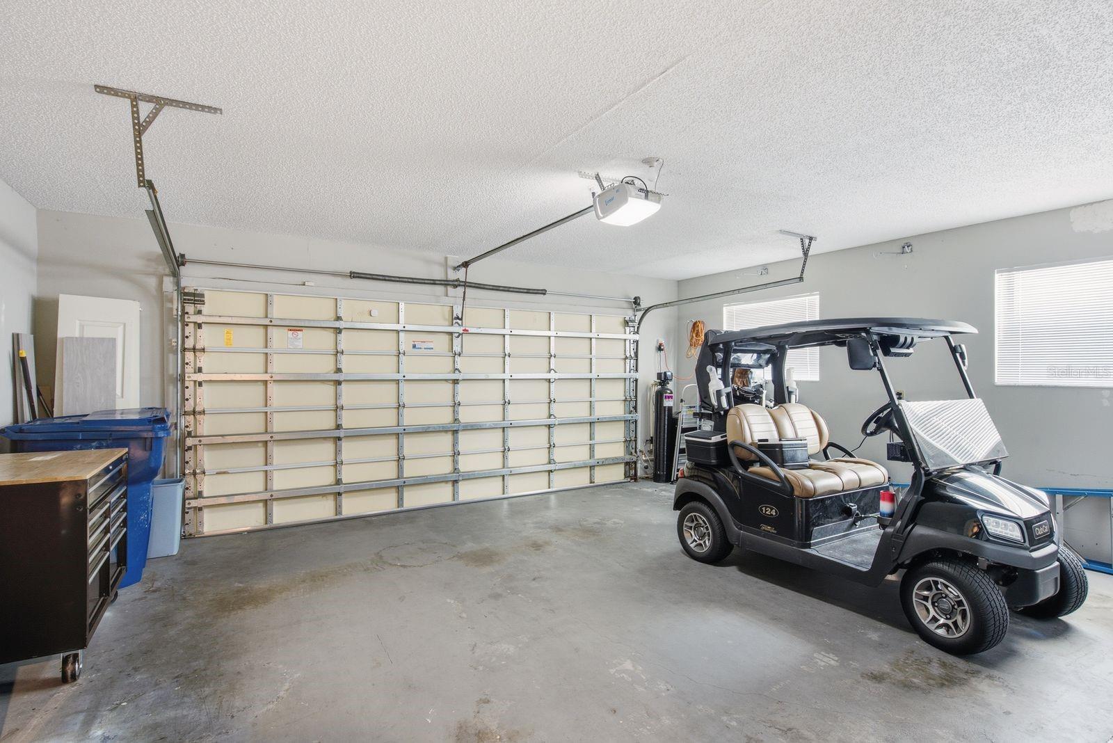 Partitioned 3 car garage/3rd stall is climate controlled.