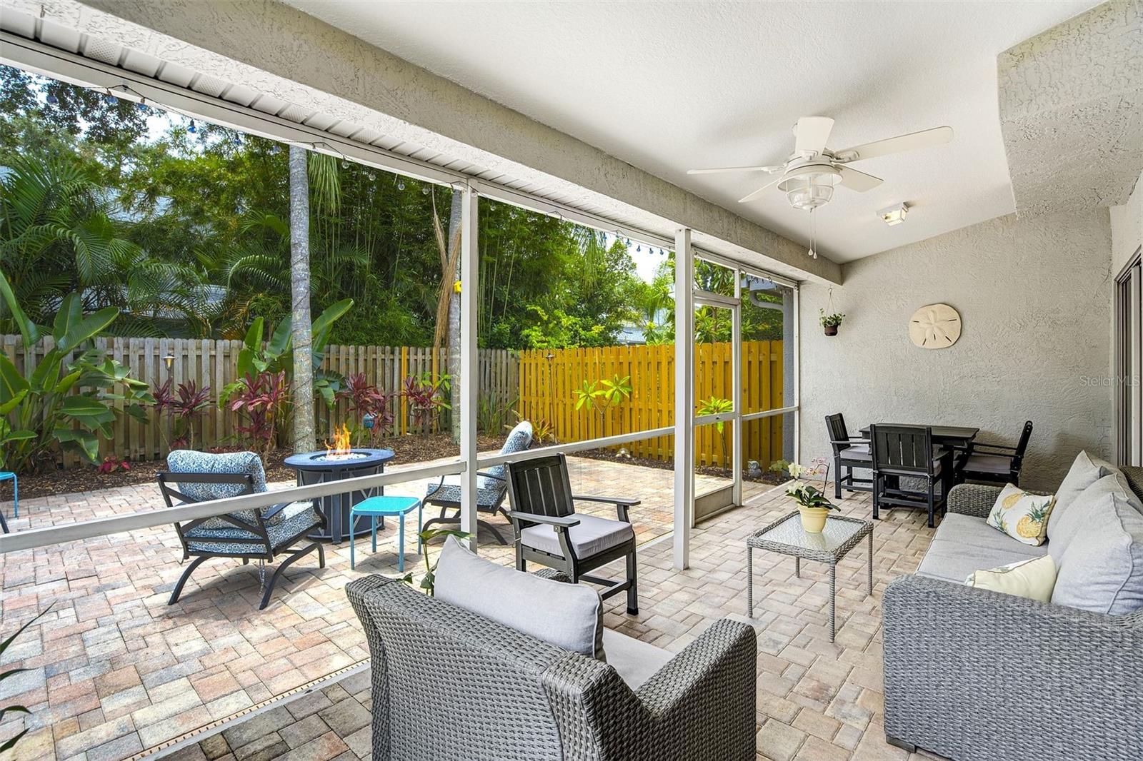 Screen Porch Open To Fenced Backyard