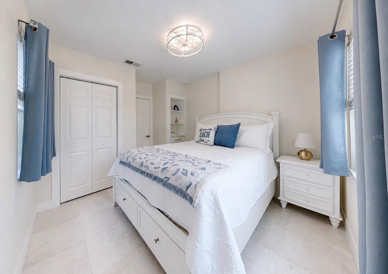 Primary Bedroom with Closet and Built-in Shelving