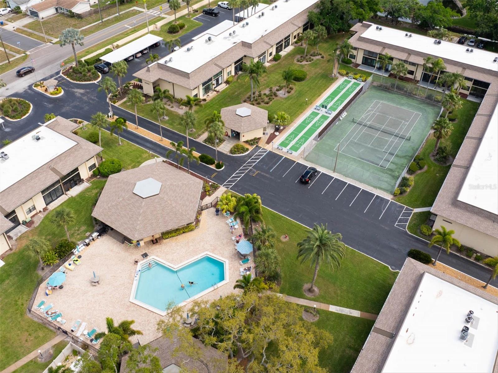Pool, clubhouse, tennis and pickle ball courts and shuffleboard