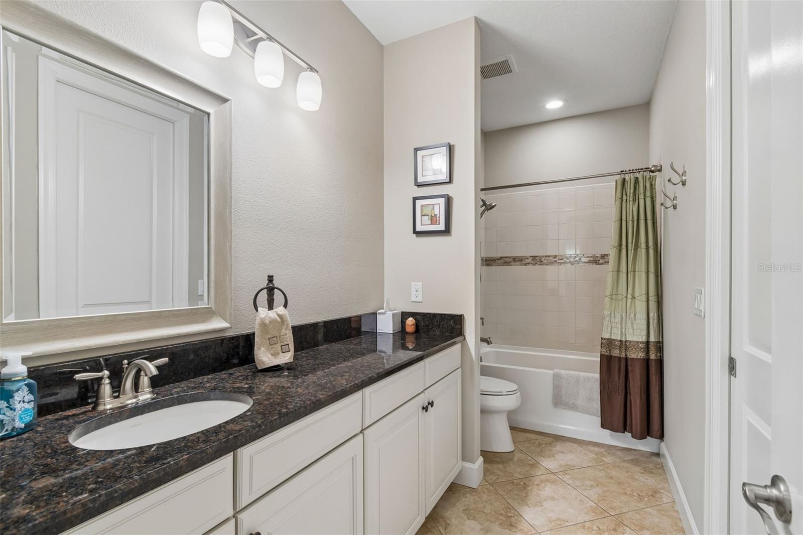 Main bathroom located between bedrooms 2 and 3