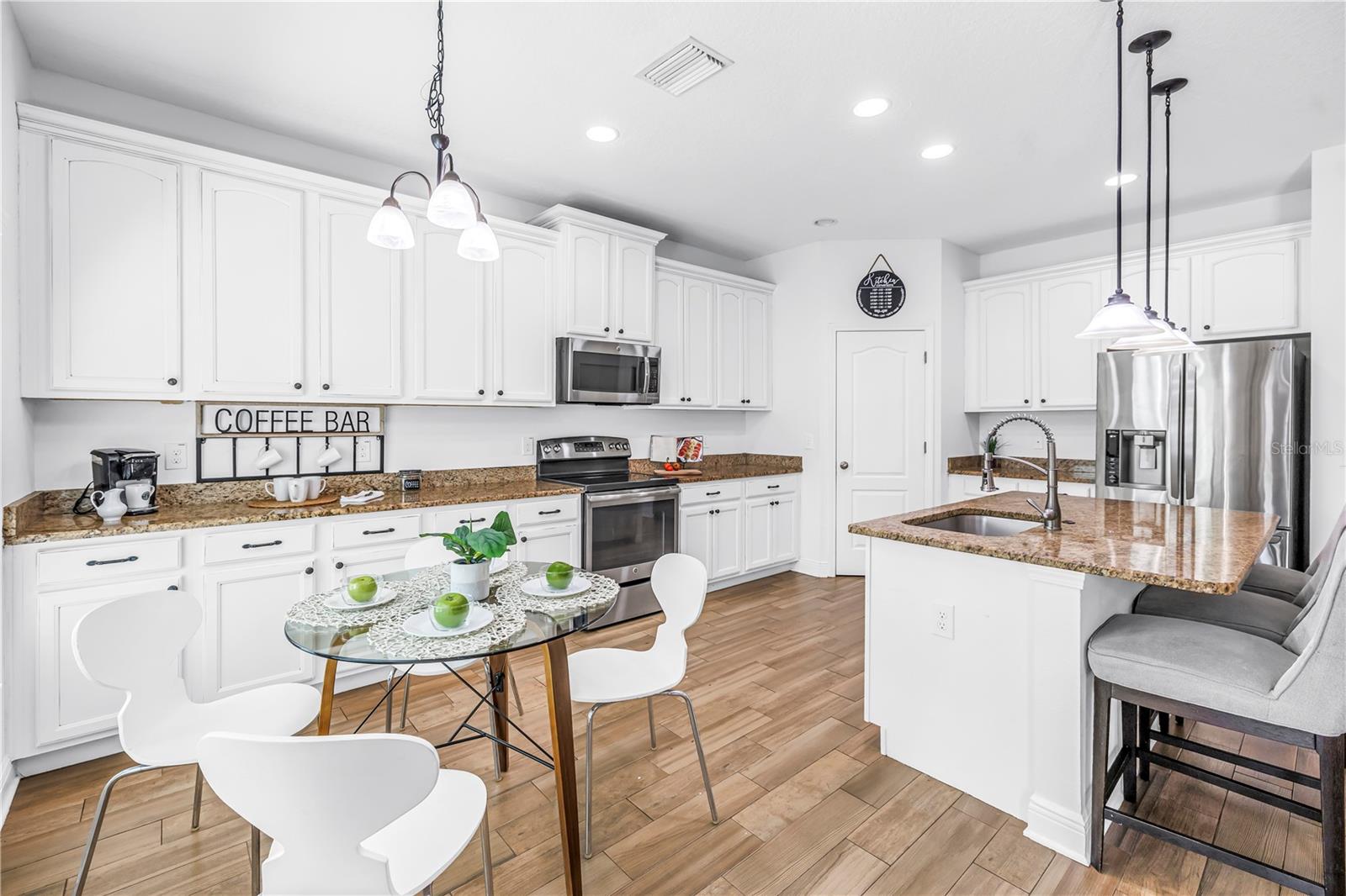 KITCHEN OPEN TO FAMILY ROOM
