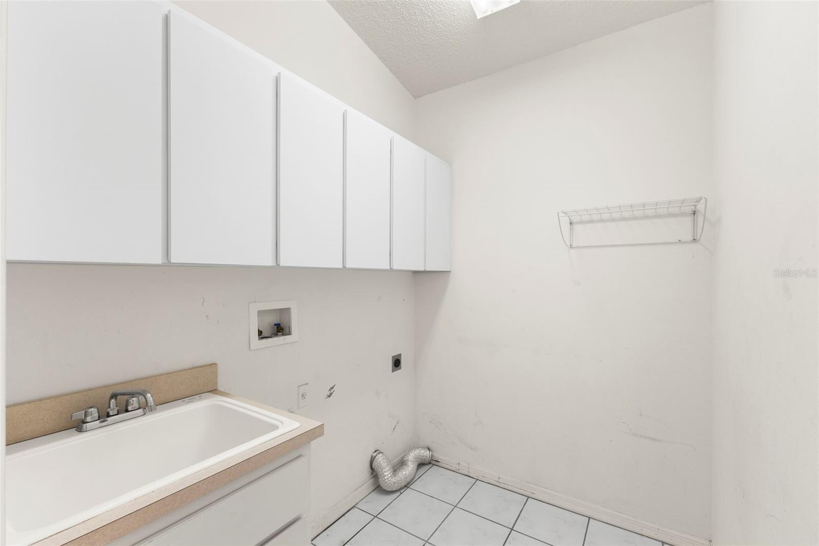 Laundry room located off kitchen