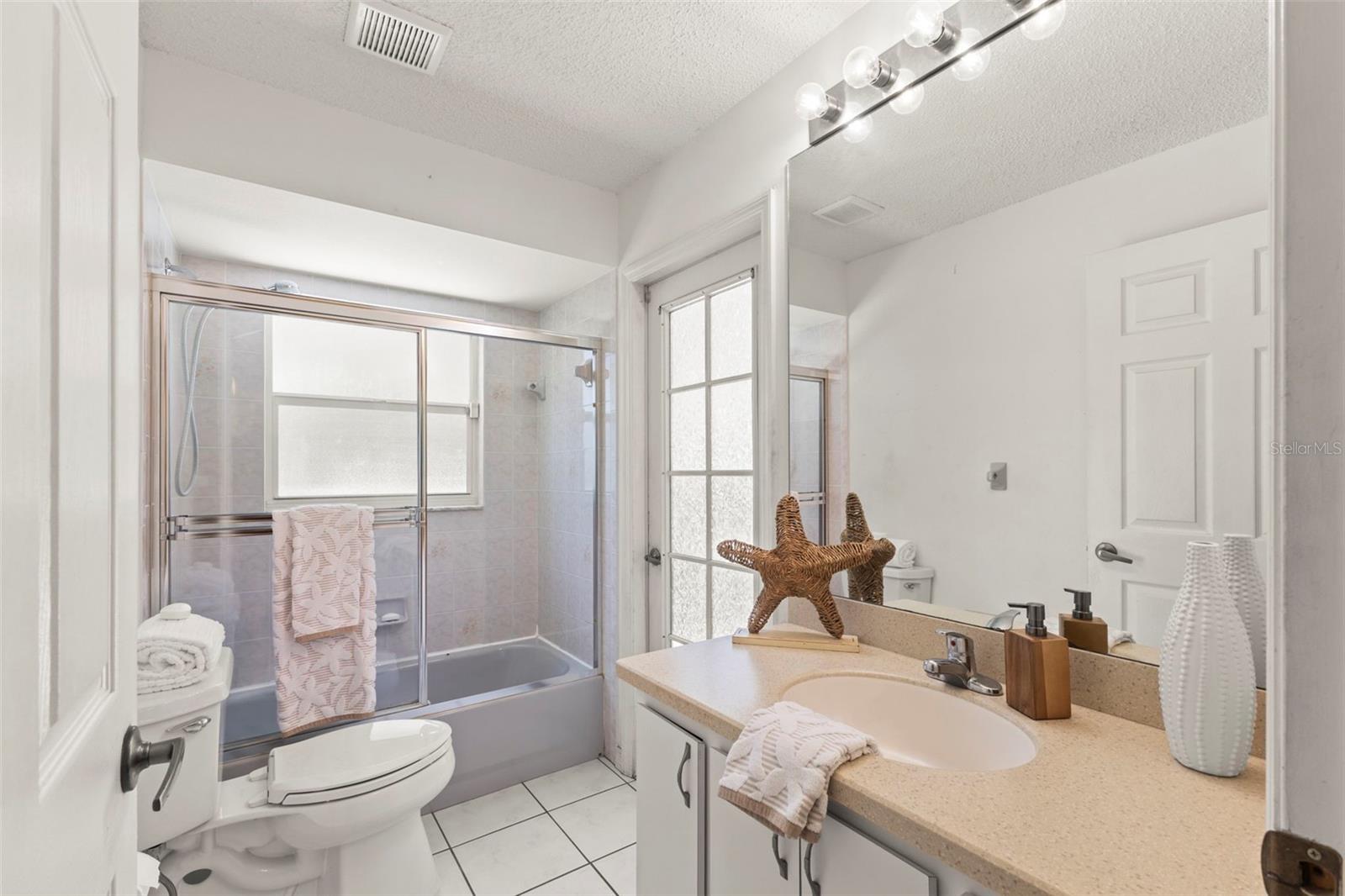 Second full bath with access to lanai/pool
