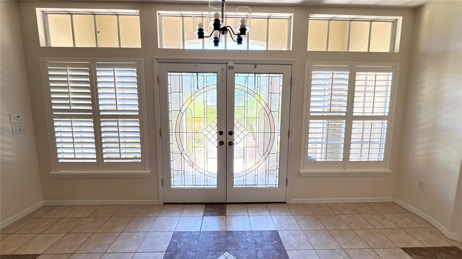 Foyer w/special order stain glass double entry