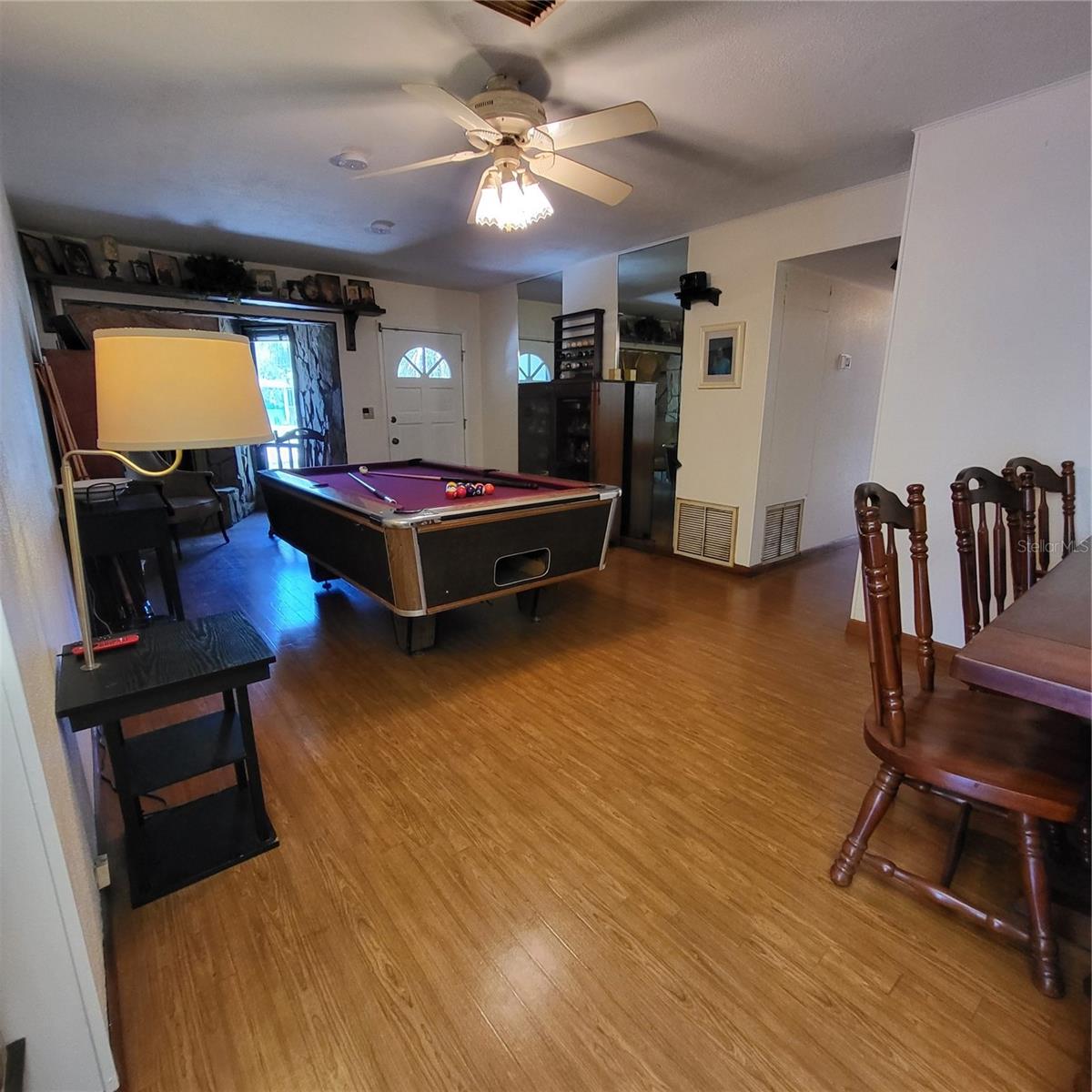 Hallway on the right leads to 3 bedrooms, office and full bath