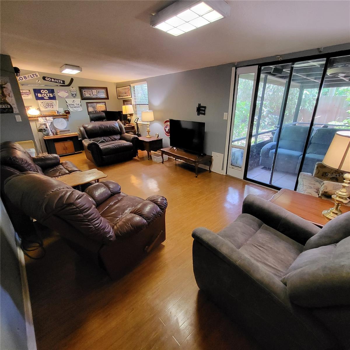 Family room/Bonus area has sliding glass doors to back patio.