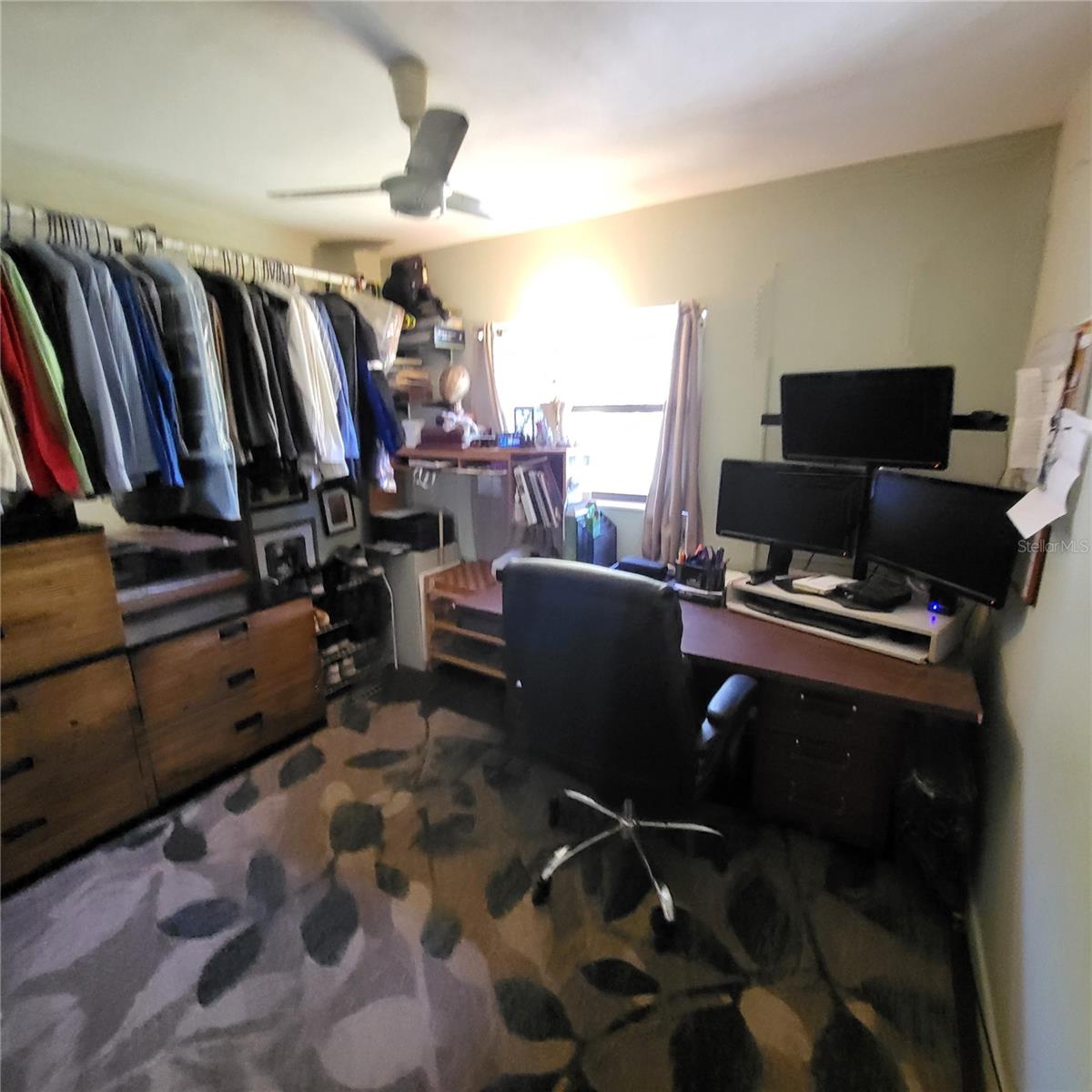 Bedroom one is currently used as a storage area and office