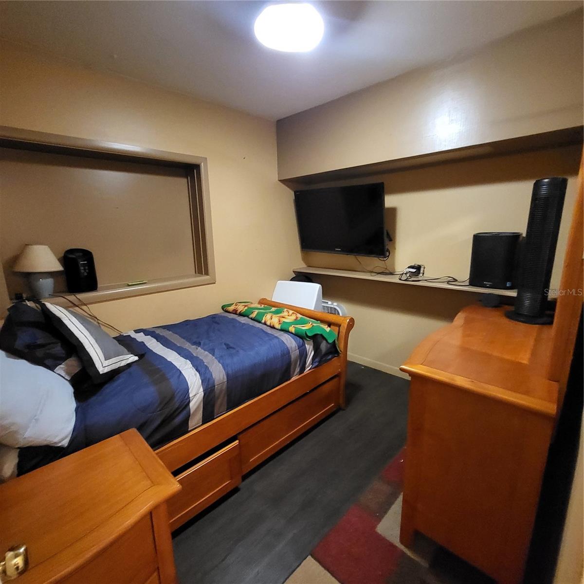 Currently used as a guest room, but could make a great office, media room or nursery. There is no closet or window in this room.