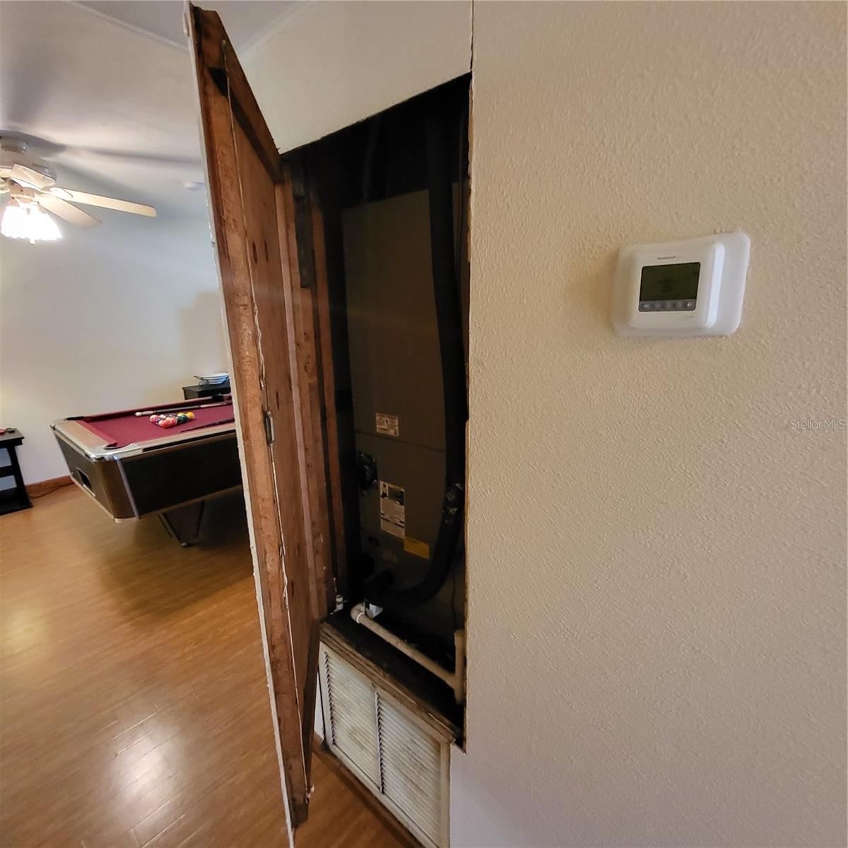 Air handler is behind access door in hallway