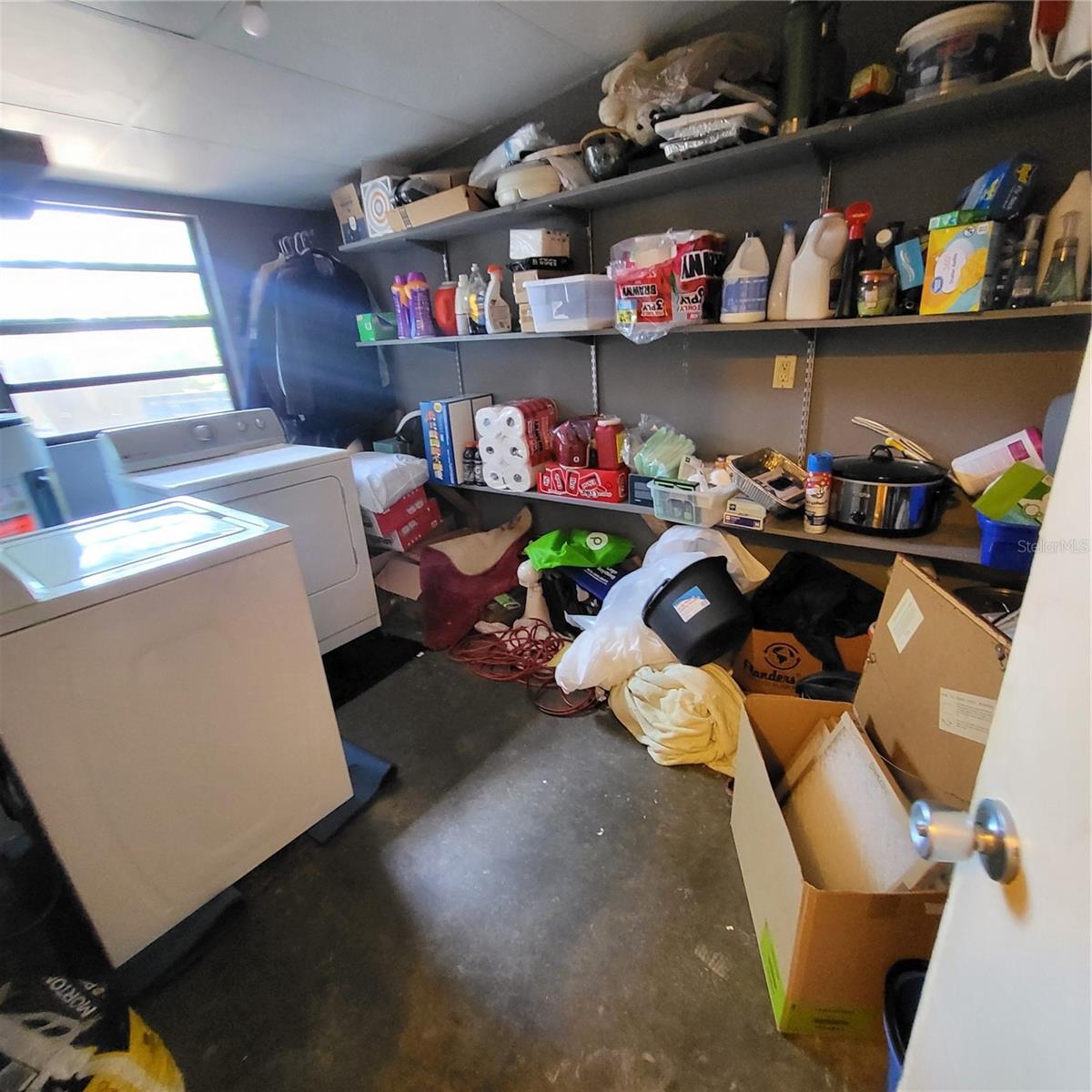 Utility room houses the hot water heater and full-size washer & dryer and still has plenty of room for storage!