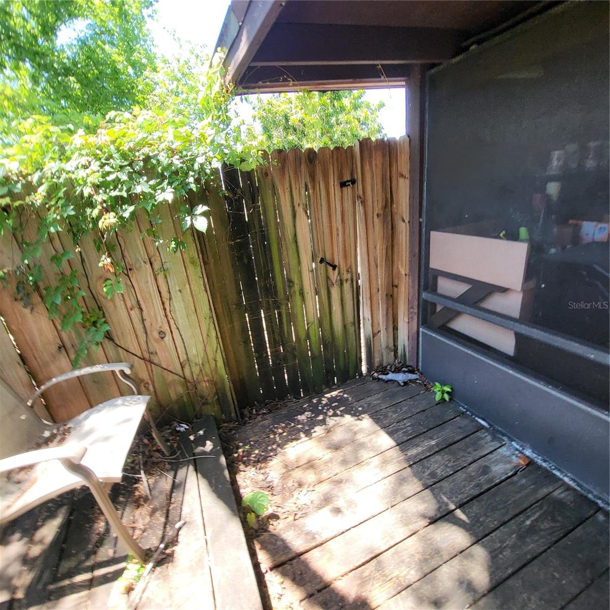 Convenient gate leads out to the north side of house and parking pad