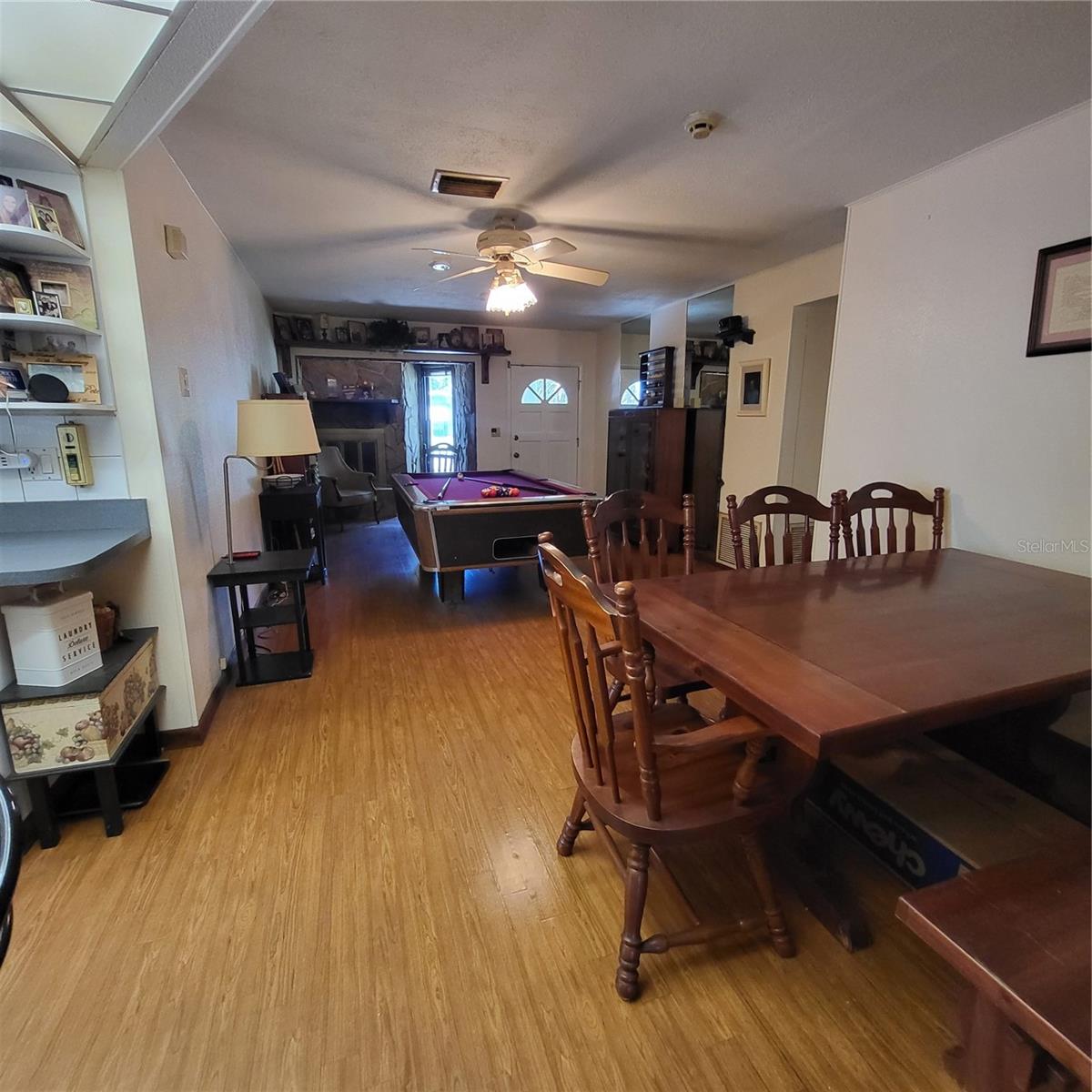Full view of living room with dining nook off the kitchen.