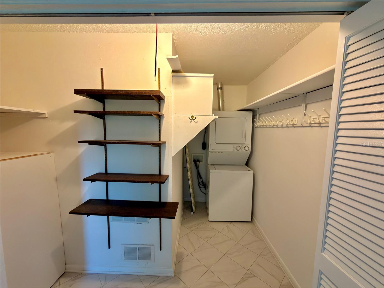Primary room closet+laundry area