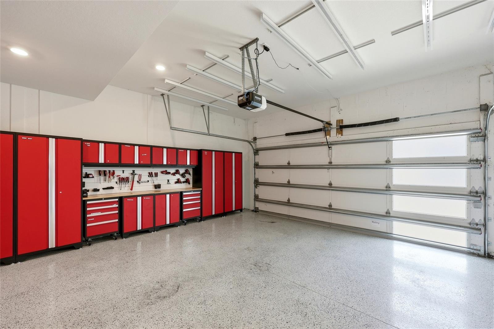 2 Car Garage with Cabinets and Built-in Ceiling Storage Tub Racks