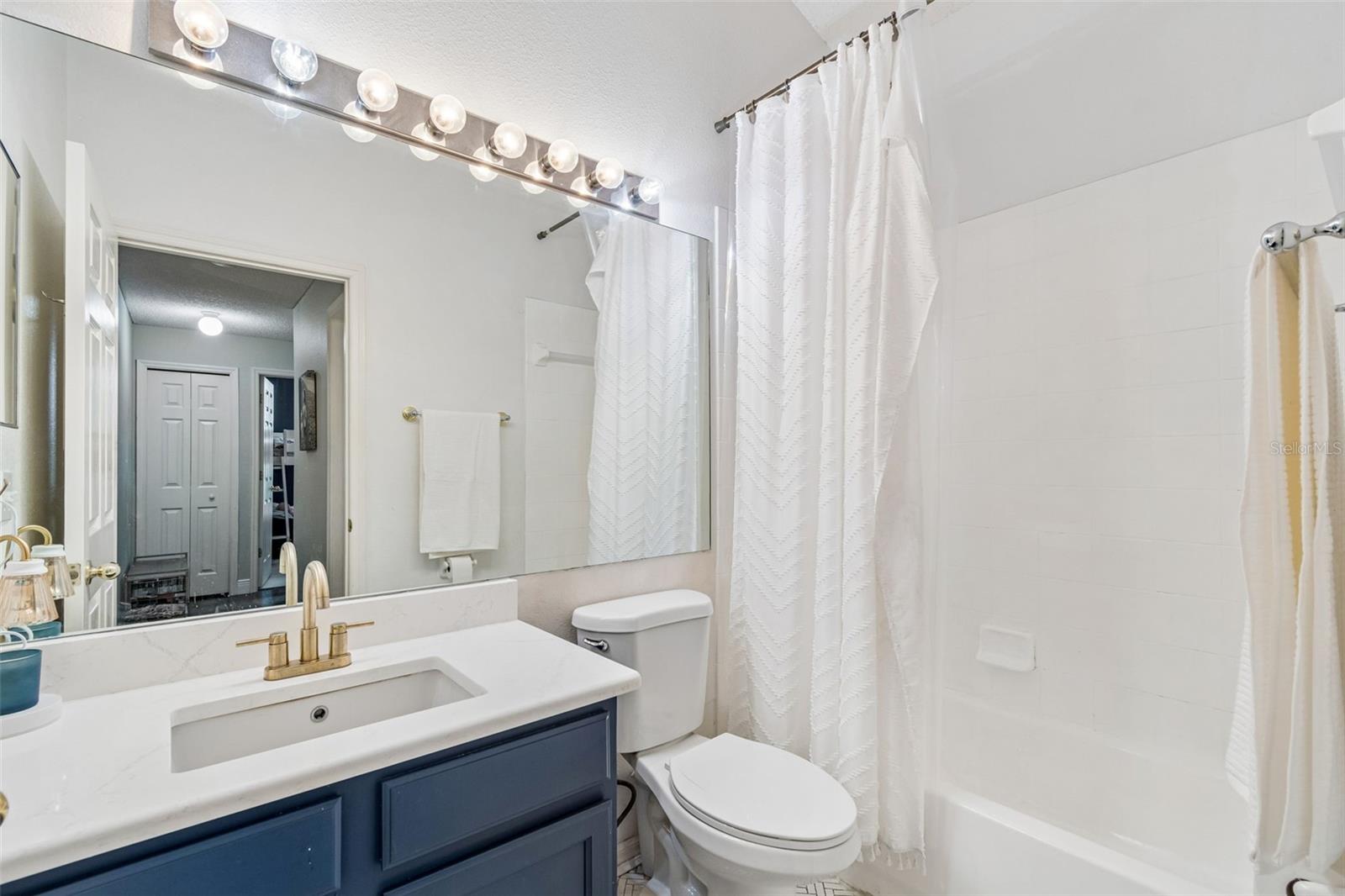 Bath 2 with quartz and herringbone tilework