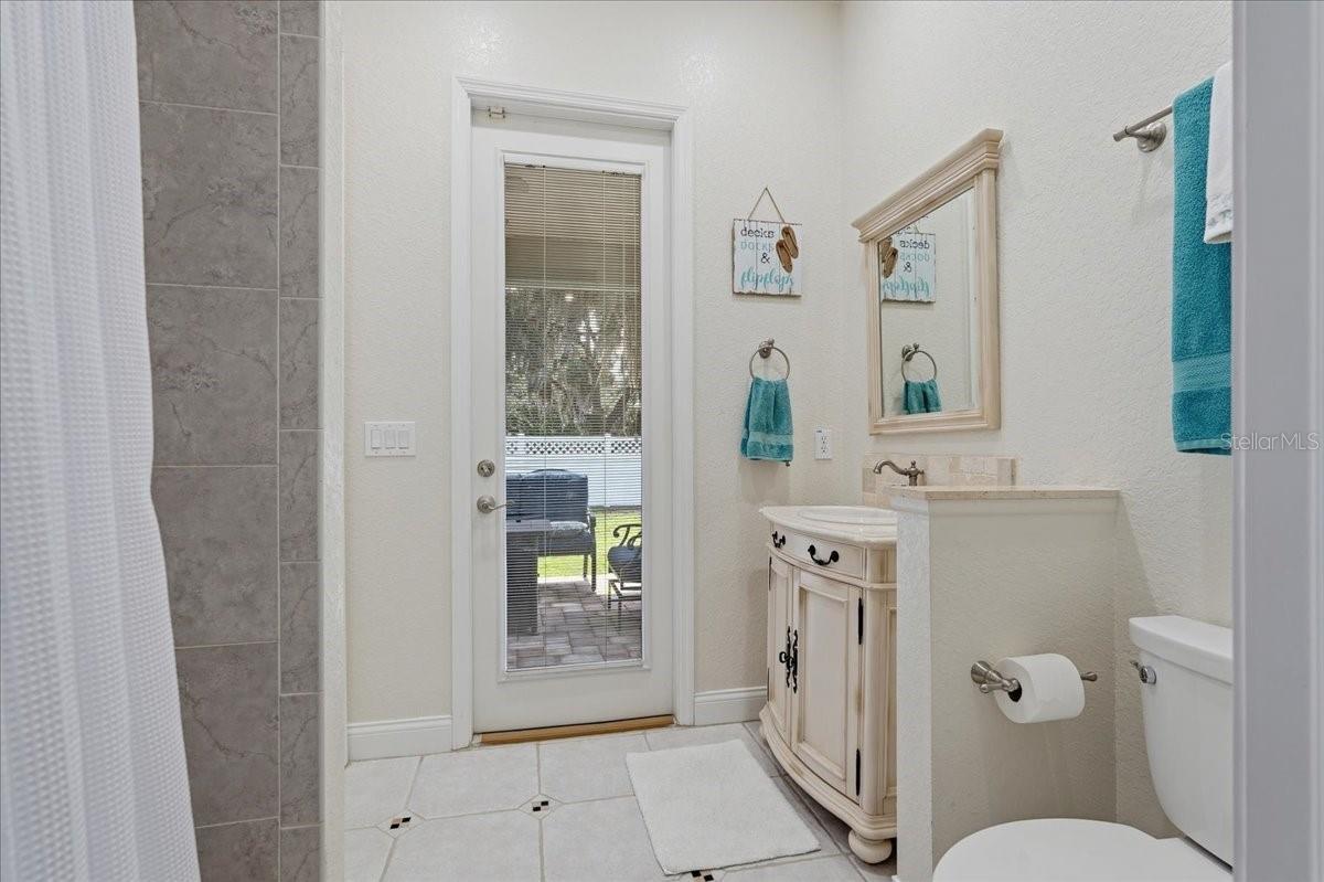 En suite bath leads to patio