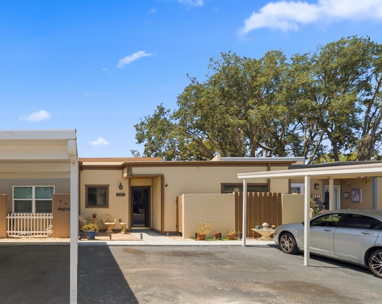 Front of the home with 3 Parking spaces, 1 covered