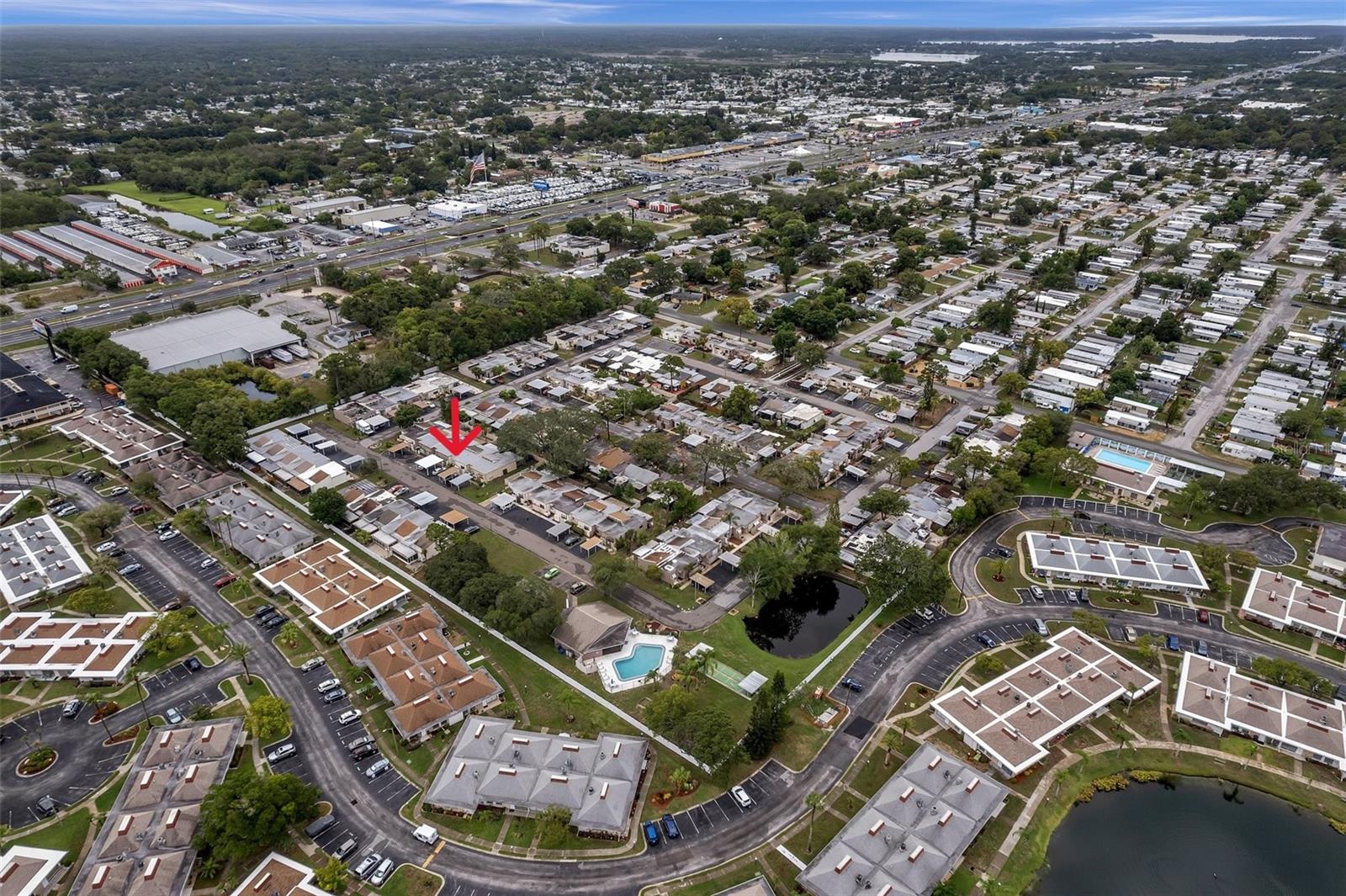 Aerial view shows short distance from unit to the pool, clubhouse and mail boxes
