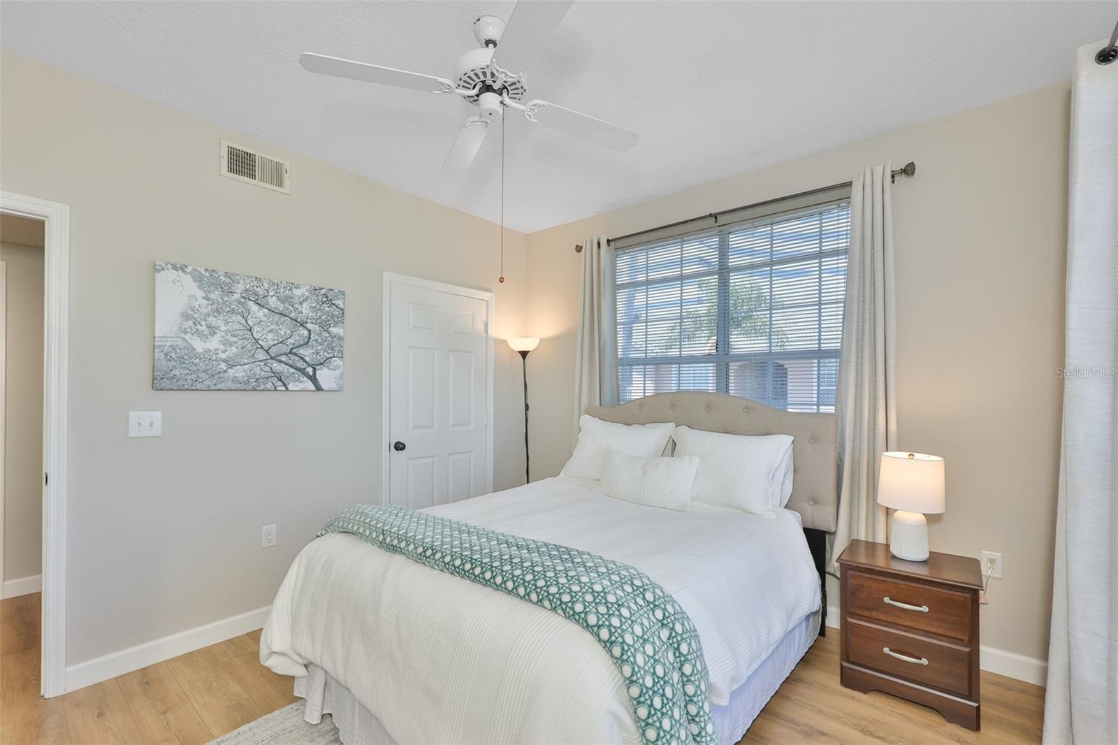 Primary bedroom with built-in shelving