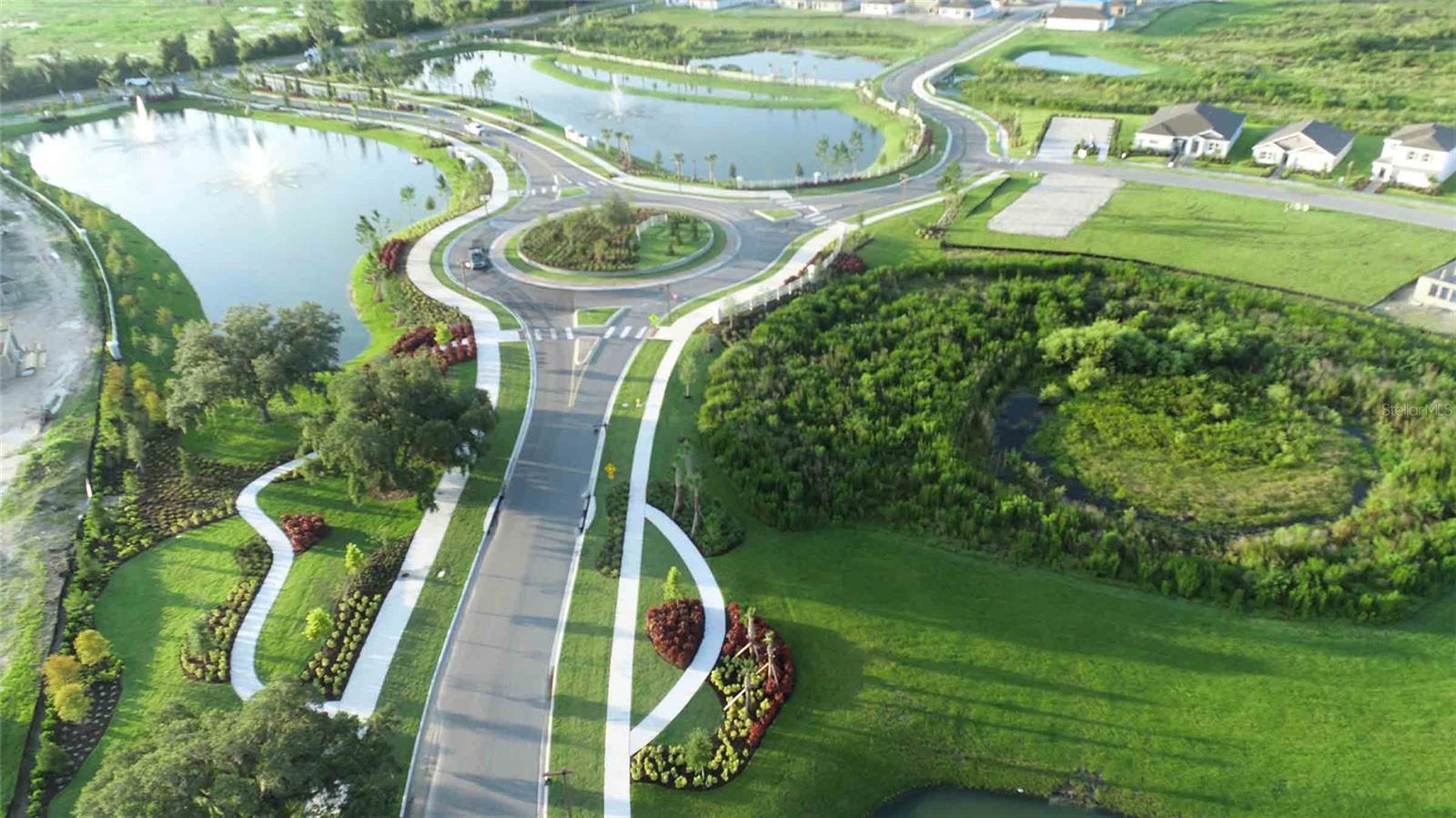 Entrance with beautiful and abundant land scaping