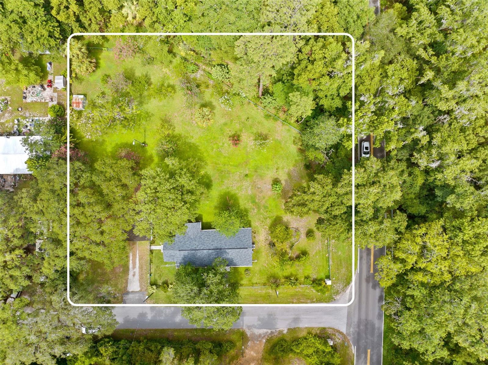 Almost a full acre with privacy fence separating the neighboring property & chainlink surrounding the rest.
