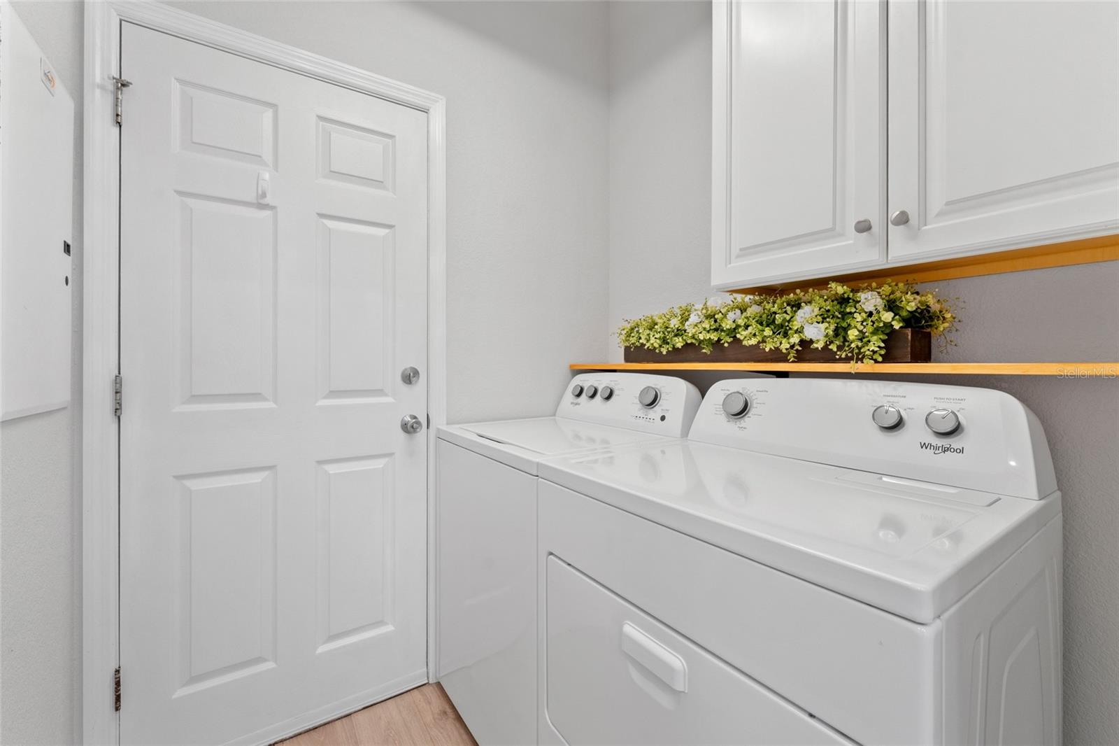 Laundry room with built-in cabinetry