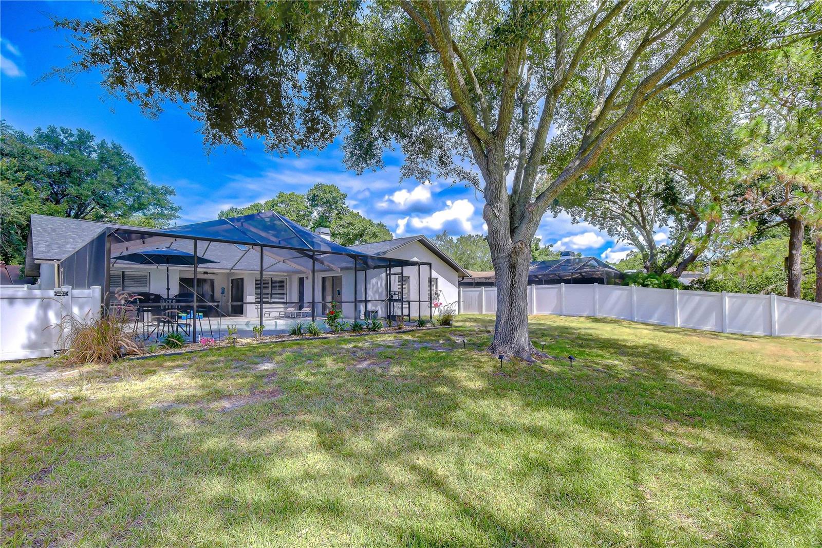 Spacious fenced backyard combining privacy with scenic fairway views.