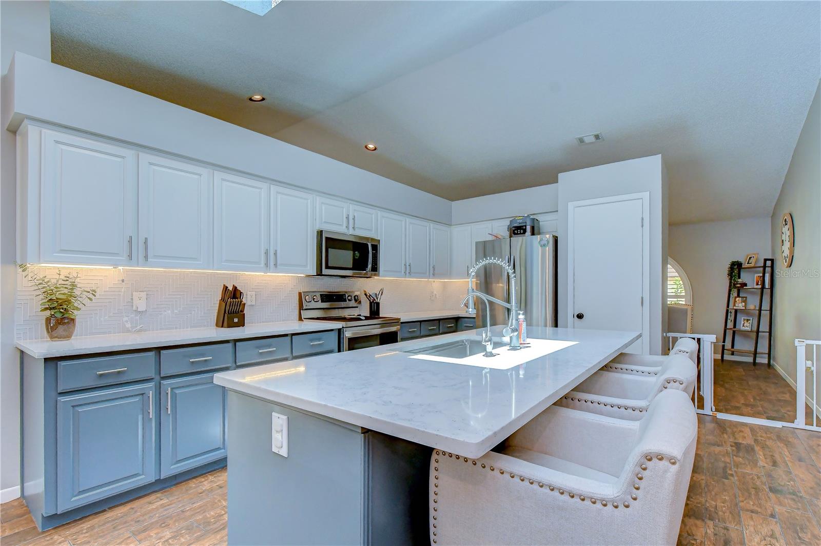 Professionally resurfaced cabinetry with fresh modern appeal.