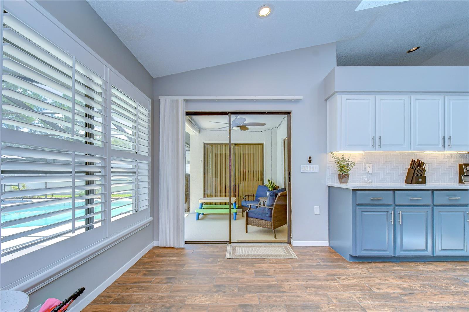 Fresh paint, custom shutters, and modern blinds throughout.