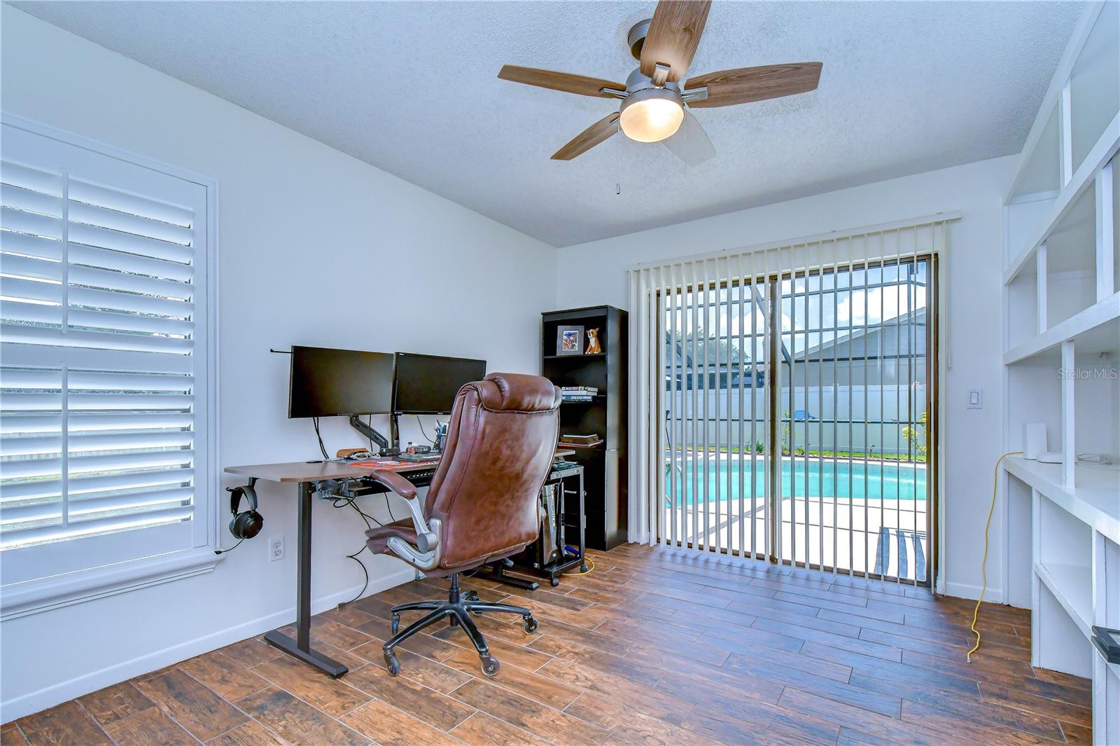 Flexible bedroom suitable for home office or guest accommodations.