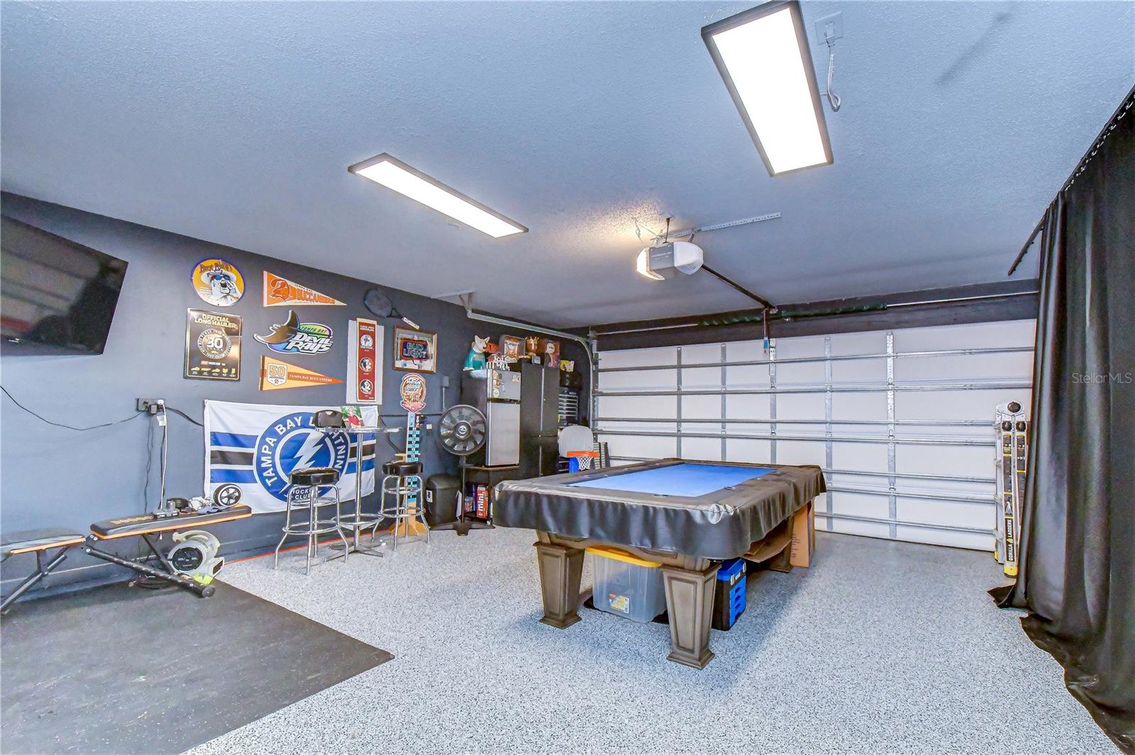 Fully upgraded climate-controlled garage offering exceptional versatility.