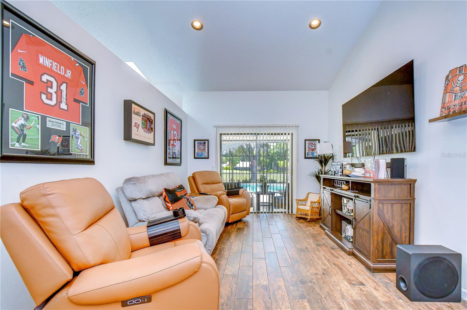 Elegant gathering space with beautiful pool and lanai views.