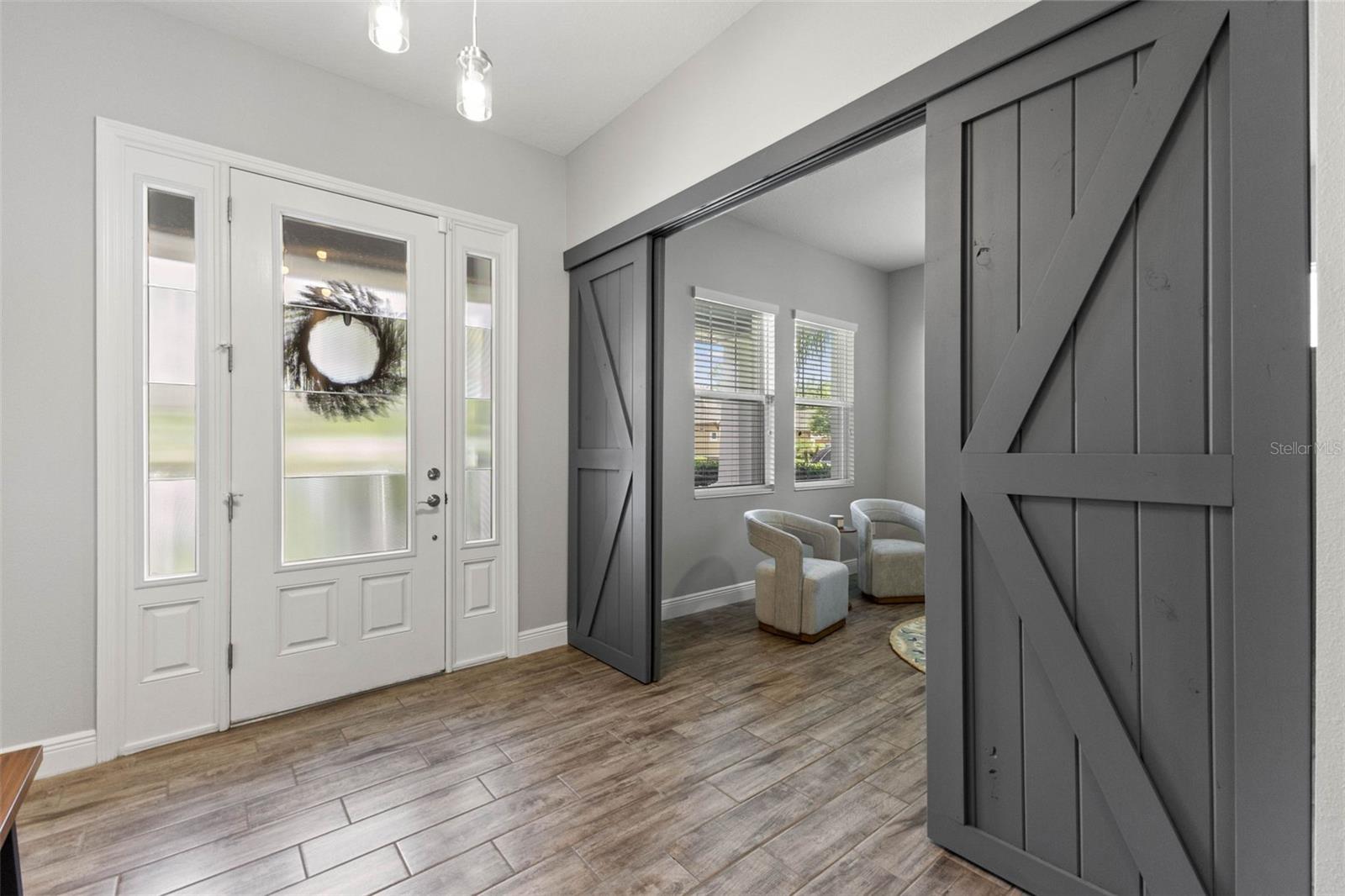 Bonus Room off entry complete with Barn Doors for privacy