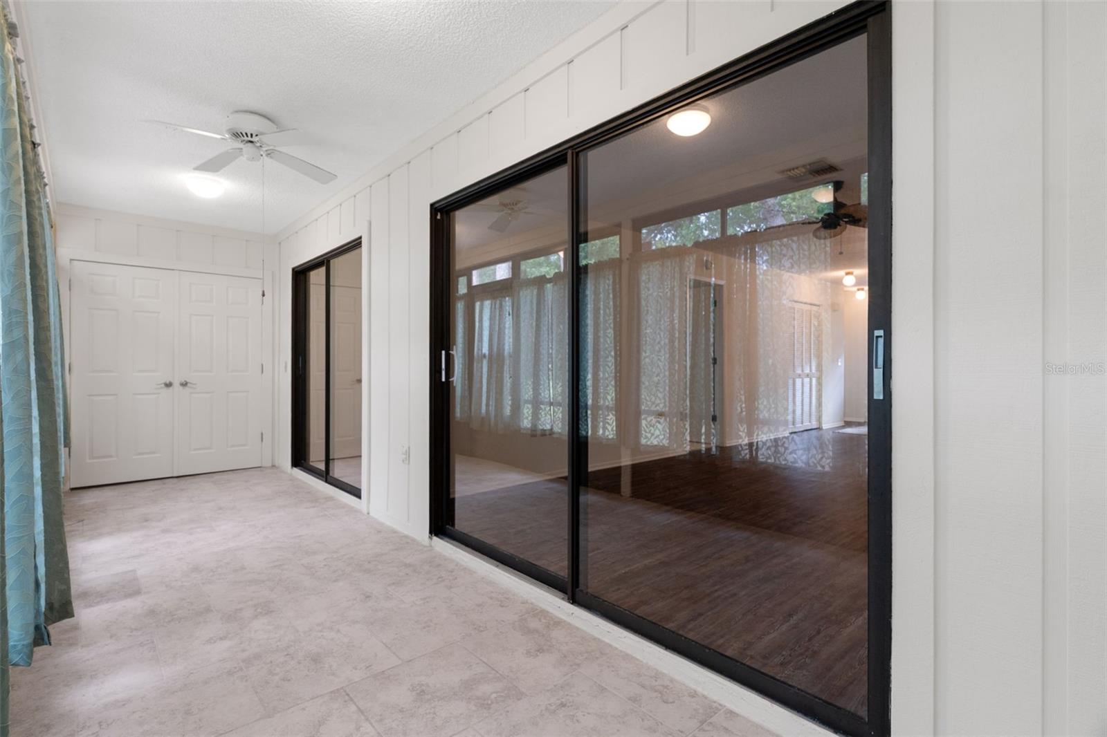 Enclosed room with windows that slide open the screens