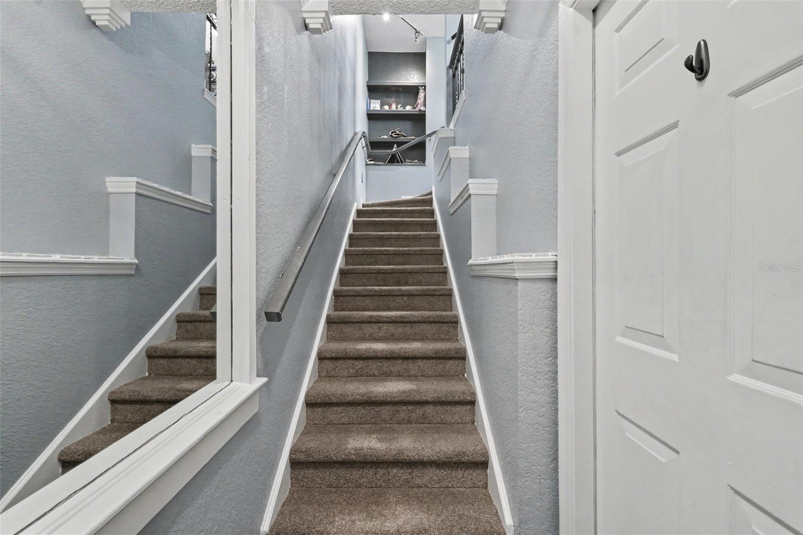 Garage door and stairs to Living Room