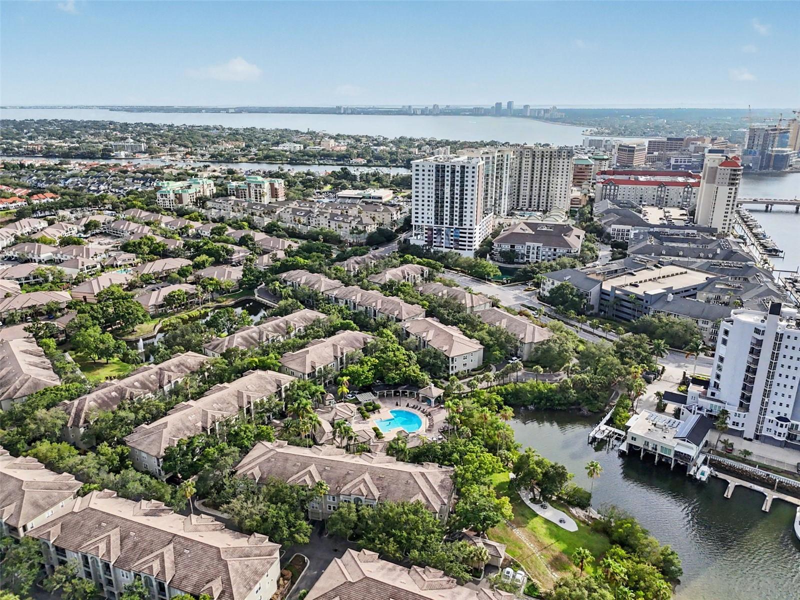 End unit with harbor and pool views