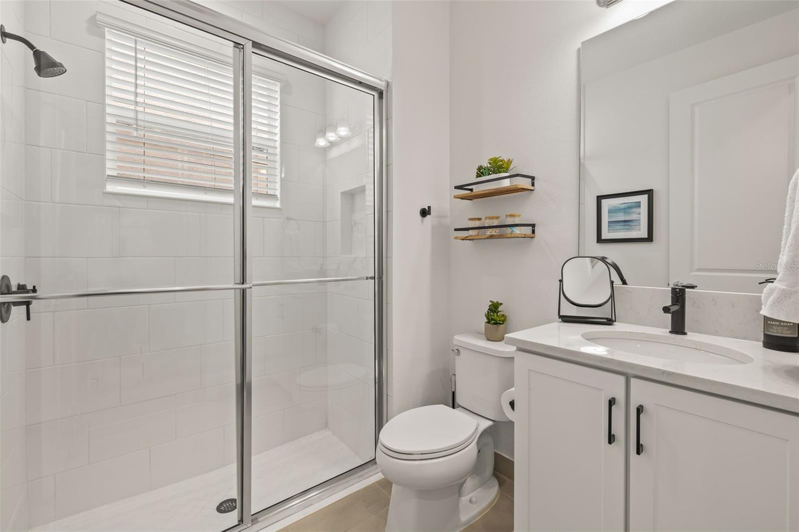 First Floor Bathroom w/ floor to ceiling tile