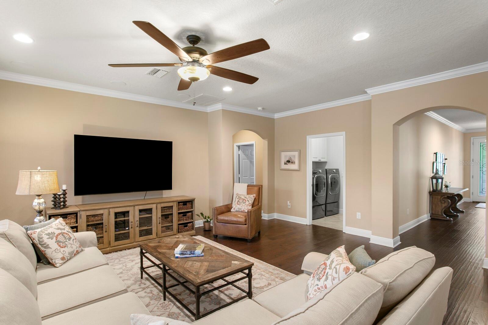 Family room with access to the utility room and 3-car oversized garage