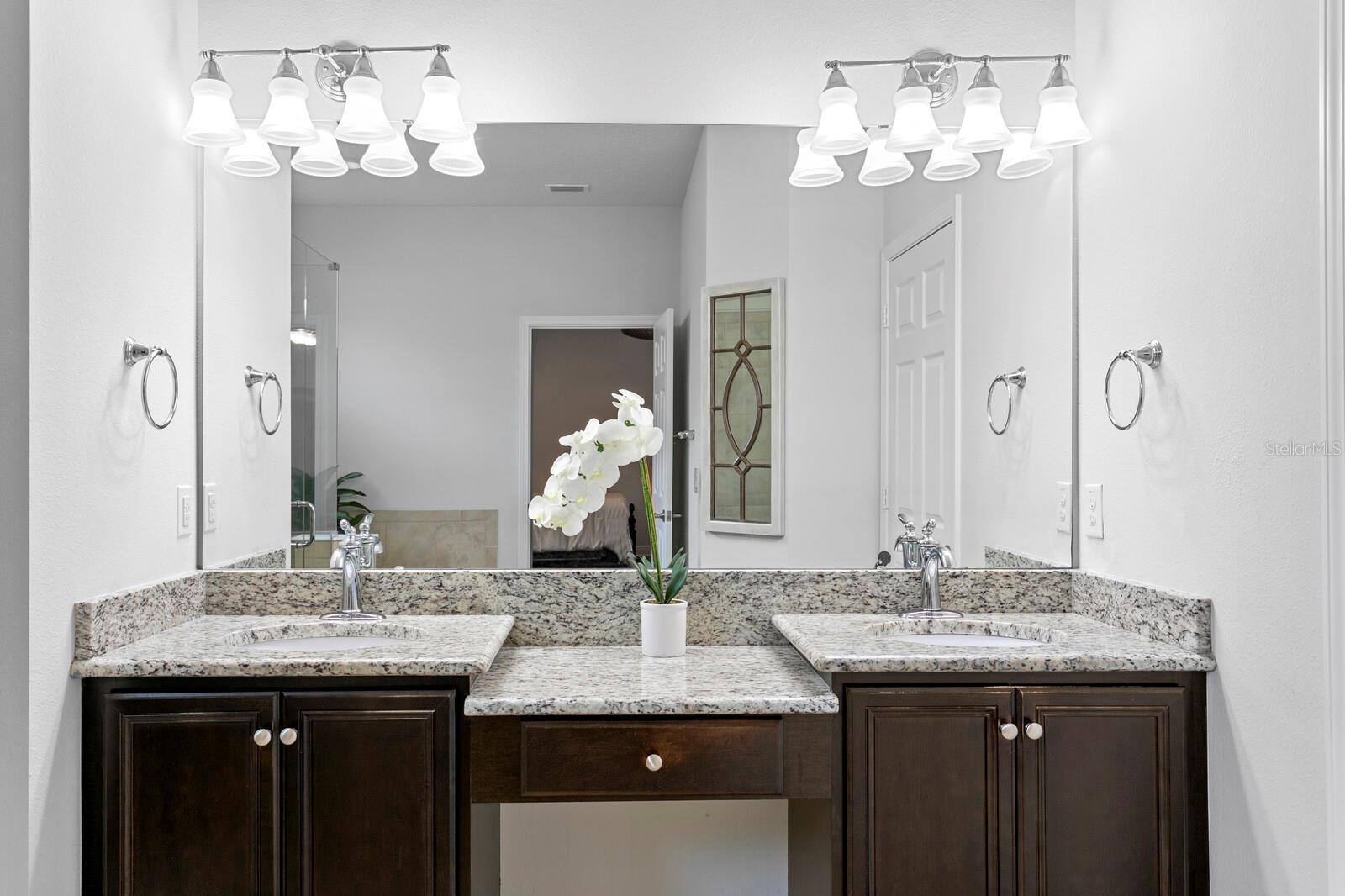 Dual vanities and make-up space in primary bathroom