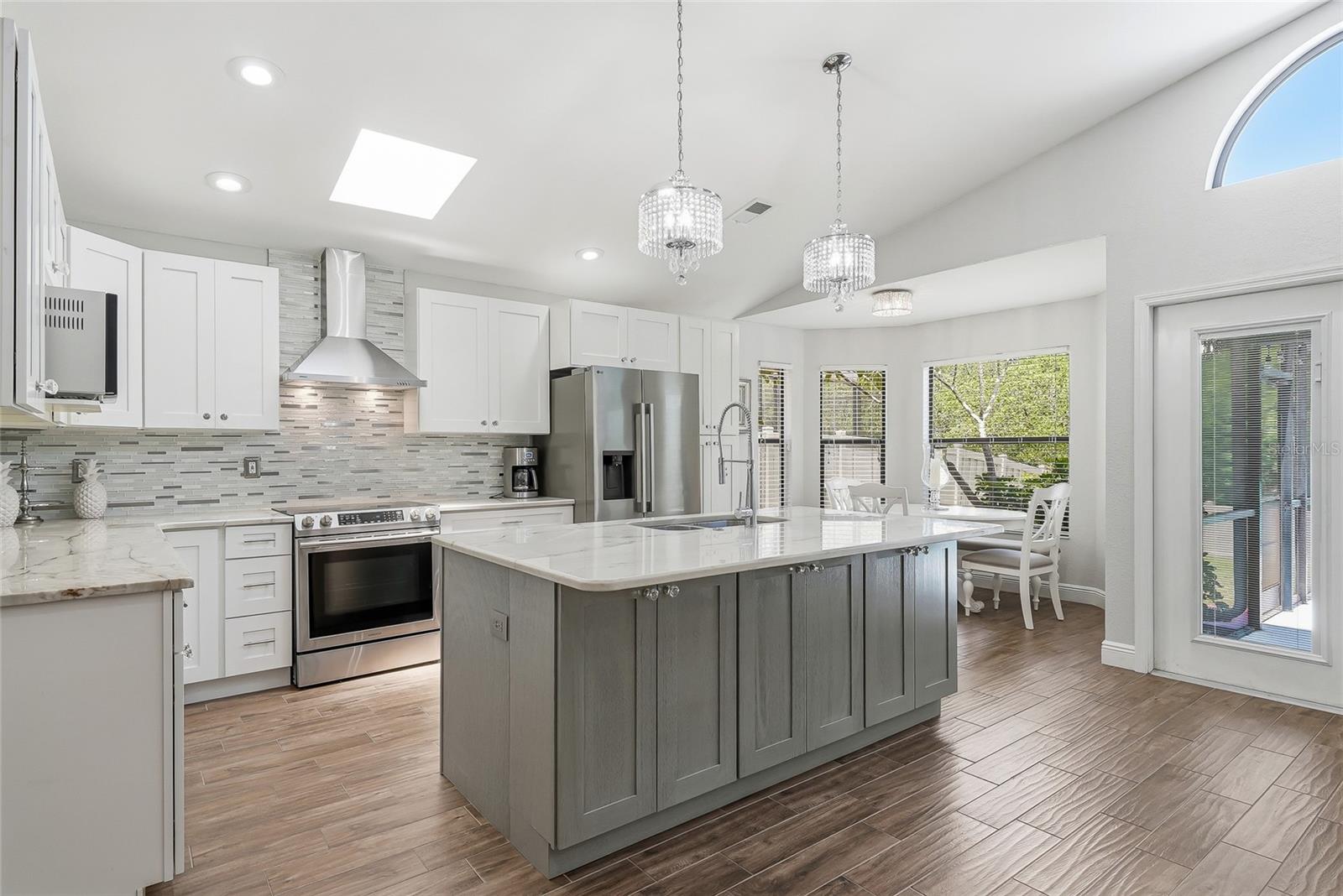 Showstopping kitchen with all the modern pleasures and a dining nook.