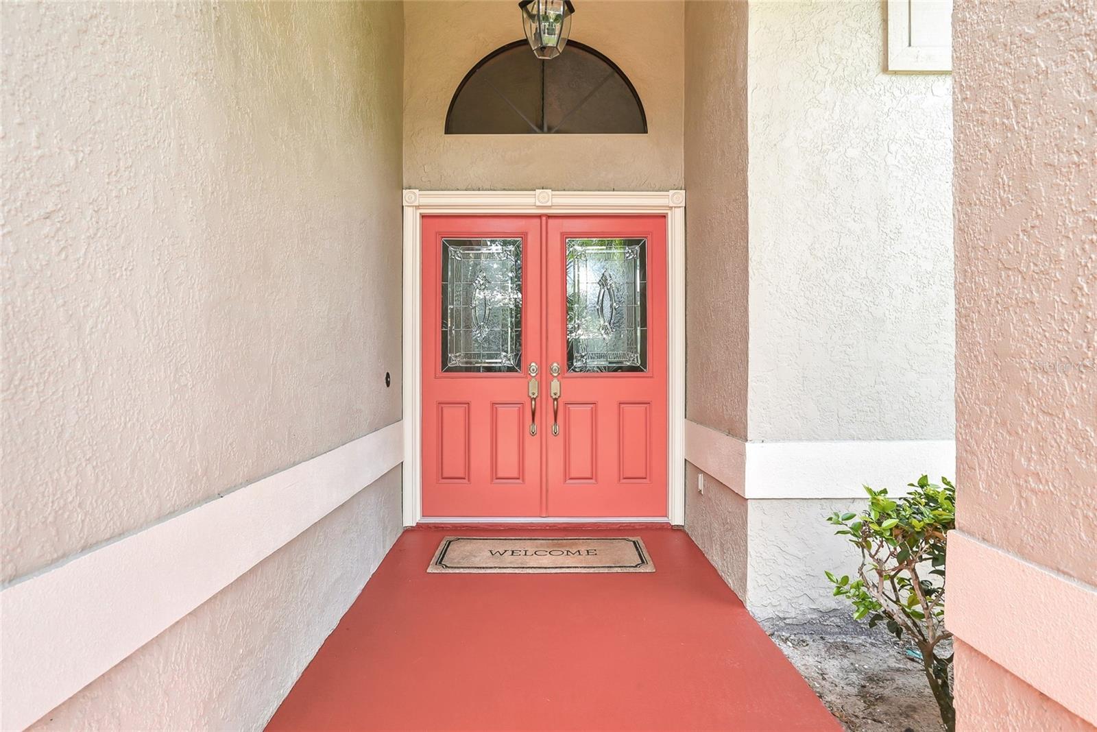 Covered approach as you near the front double doors.