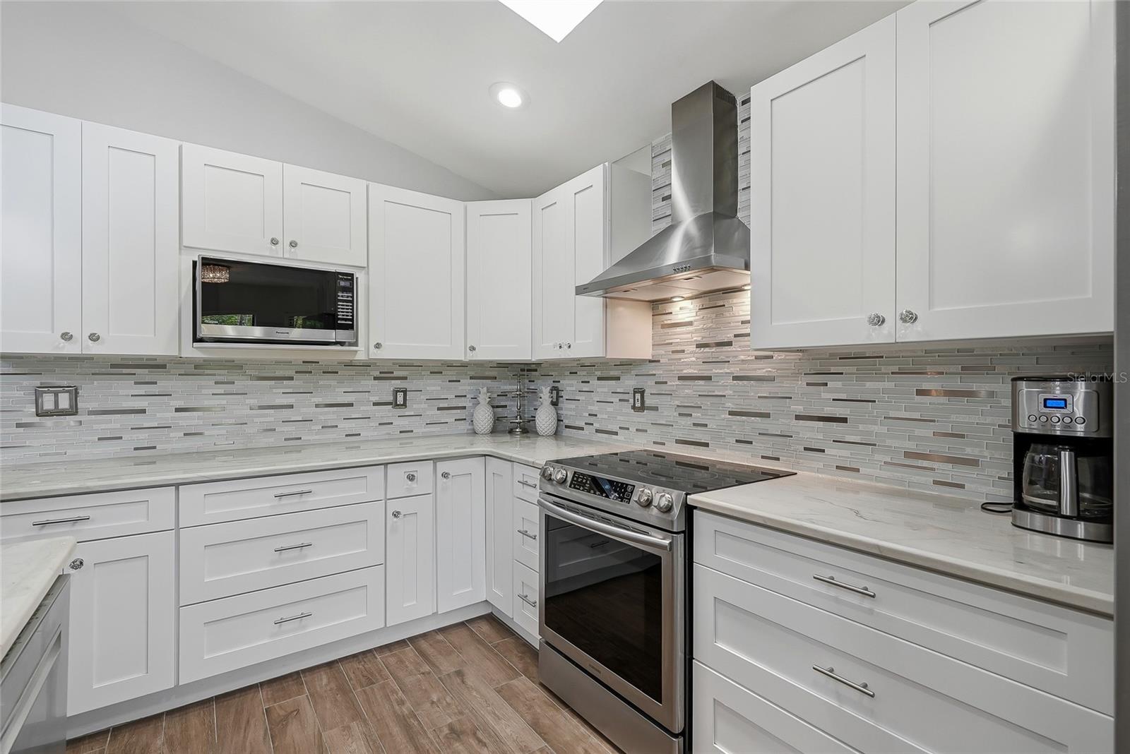 Stainless steel appliances throughout the kitchen.